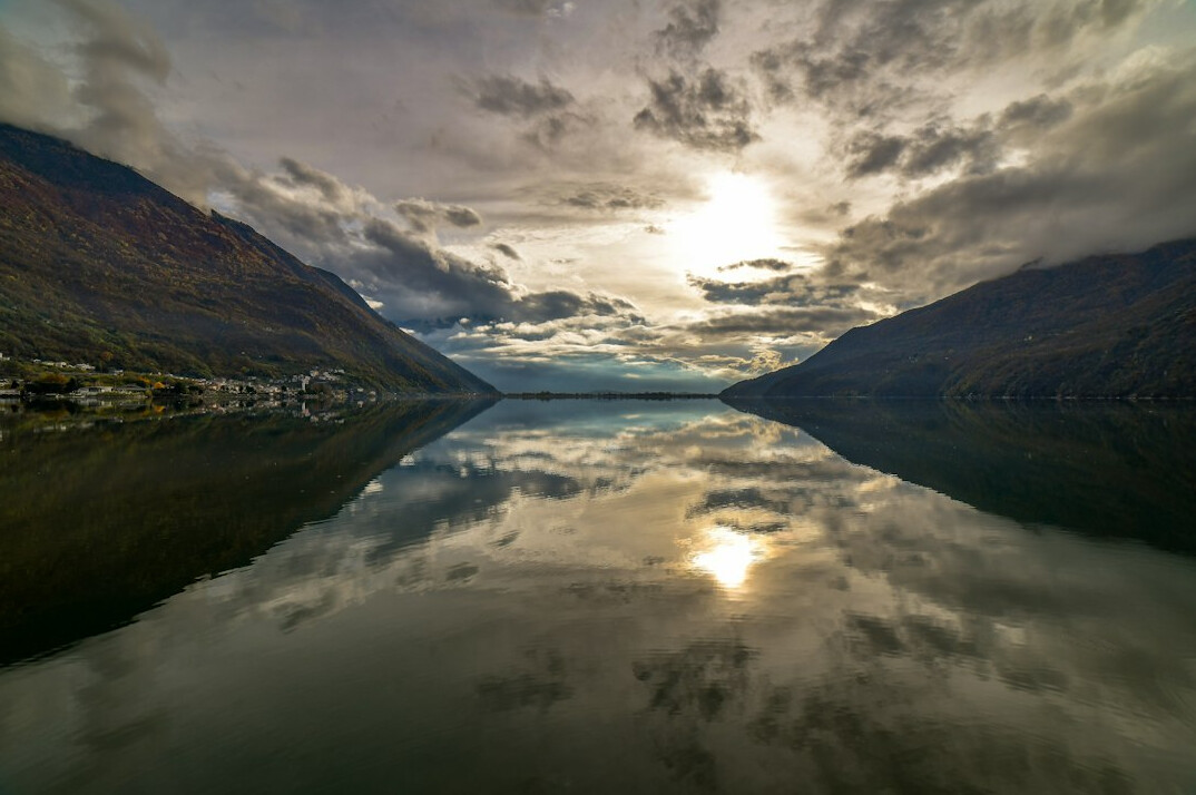 Alpine lake with mountains reflected in the water